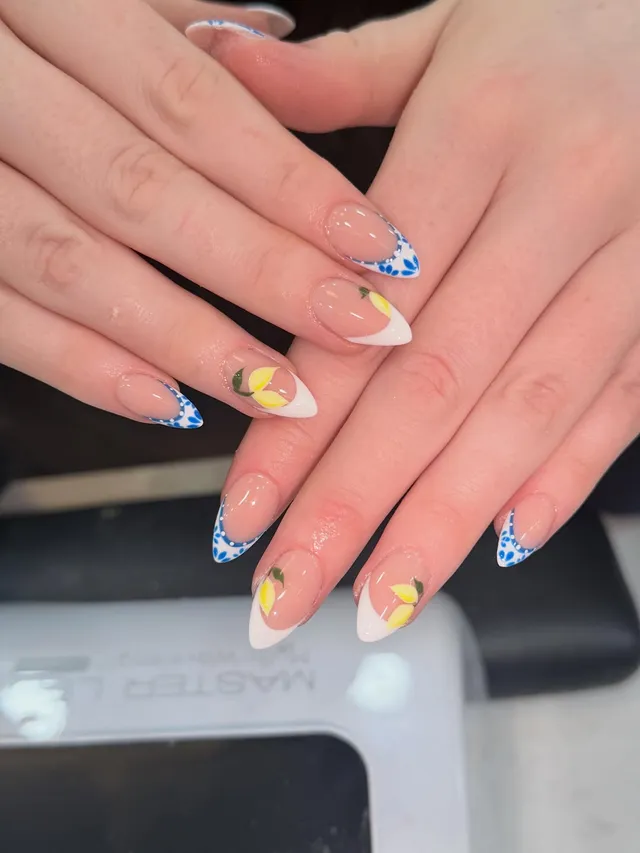 Blue floral French nails with hand-painted lemons