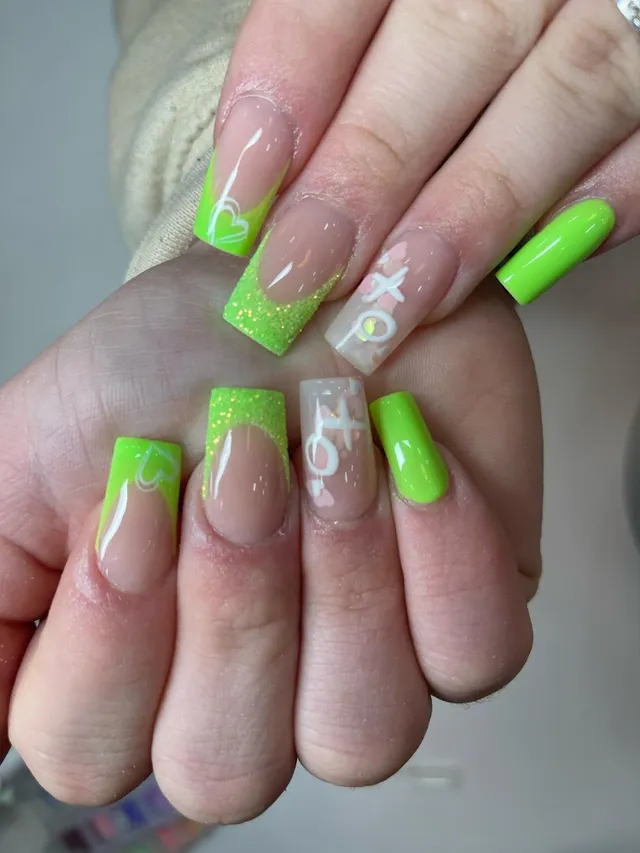 Neon green glitter nails with white XO heart art