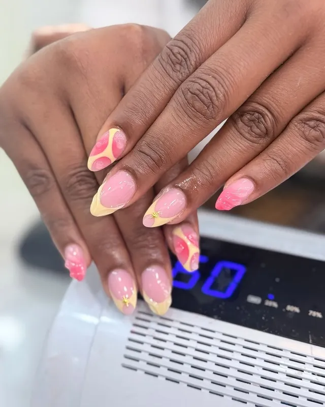 Pink and yellow swirl French nails