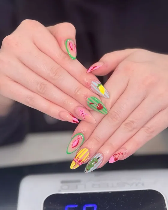 Hand-painted summer fruit nail art — cherries, lemons and stripes — at JK Nails Chester